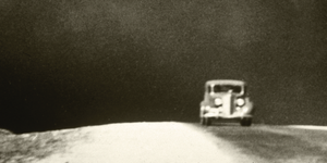 Car driving in dust storm